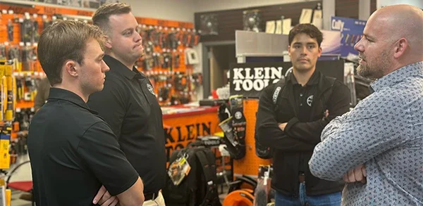 KLP participants talking to a Klein leadership executive in a store